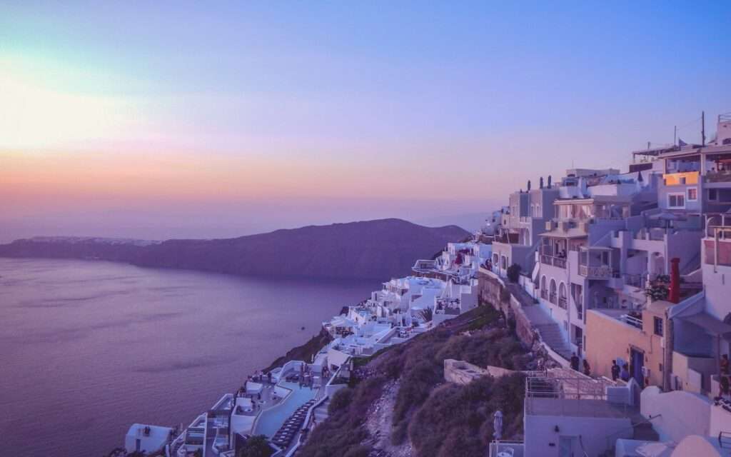 Imerovigli village on the caldera rim at dusk along the Fira-to-Oia trail